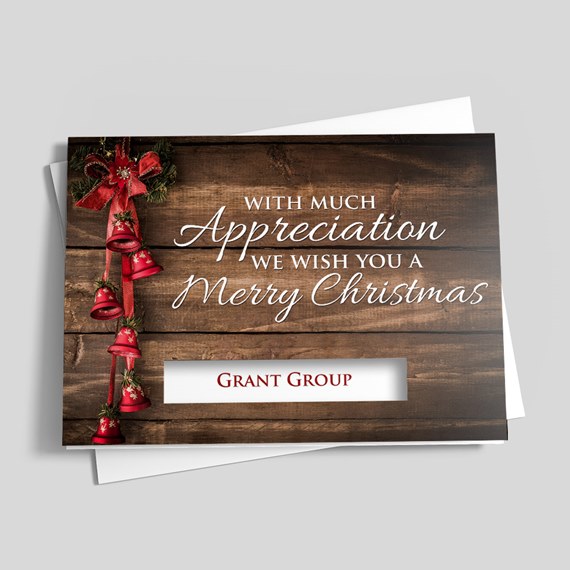 greeting card with wooden background and red bell decorations, photo placeholder