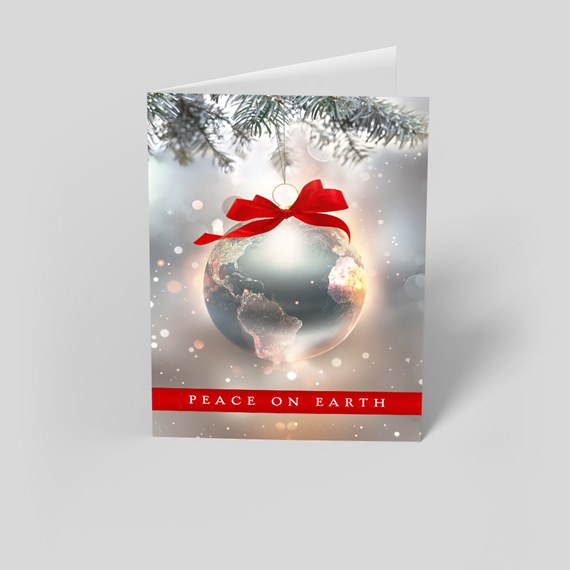 holiday card with globe ornament and red bow, text area
