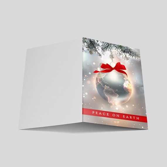 holiday card with globe ornament and red bow, text area