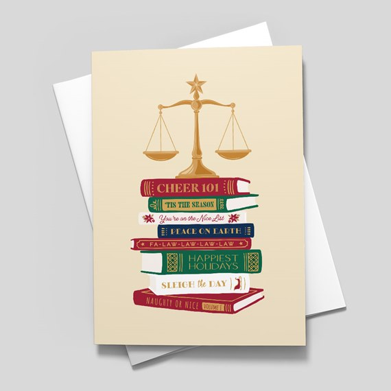 stack of books with balance scale illustration