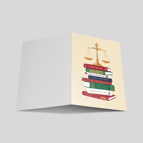 holiday card design with books and scales