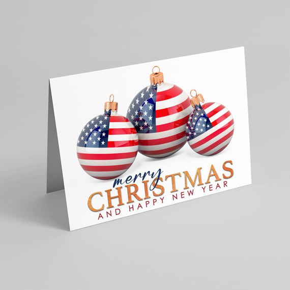 Folded Christmas greeting card with three American-flag patterned ornaments and "Merry Christmas and Happy New Year" text