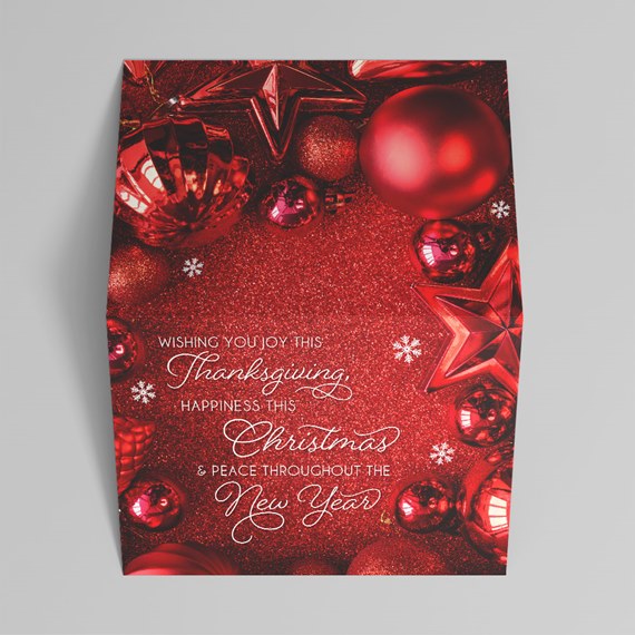 holiday greeting card design with ornaments and text