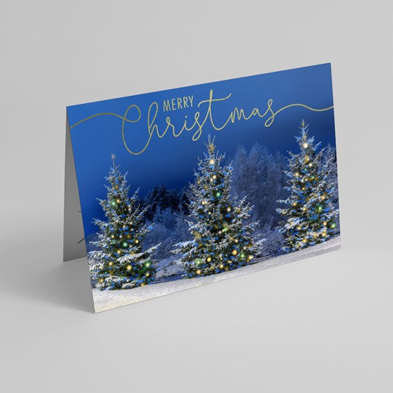 card with snowy trees and merry christmas text
