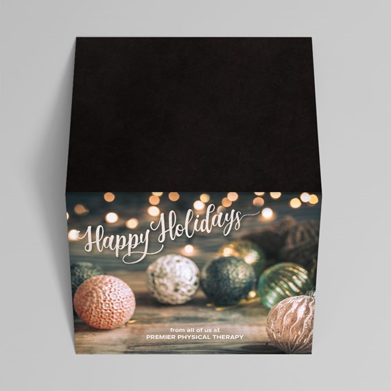 holiday card design with ornaments and lights, customizable text area