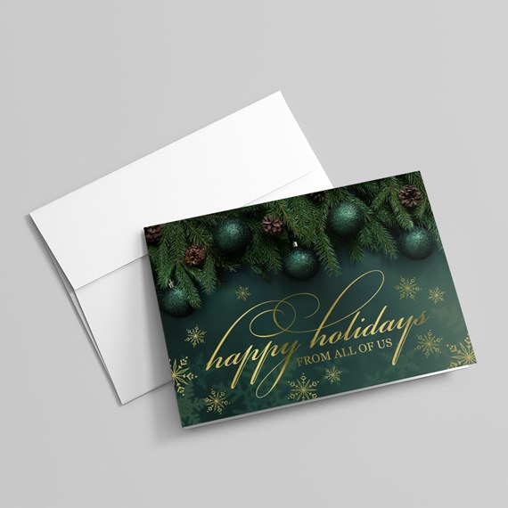 holiday card with green ornaments and pine branches