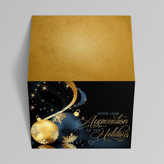decorative gift box with gold top and black front, holiday design