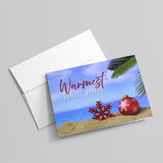 holiday card with beach scene and festive decorations