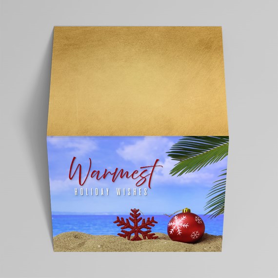 beach-themed holiday card with snowflake and ornament