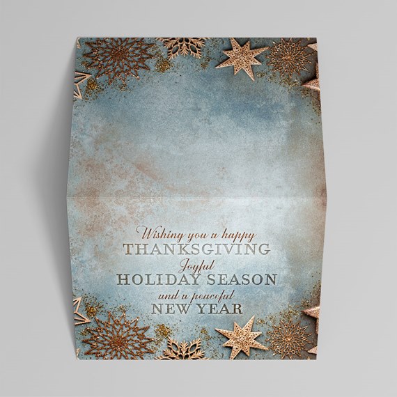 holiday card design with snowflakes and stars