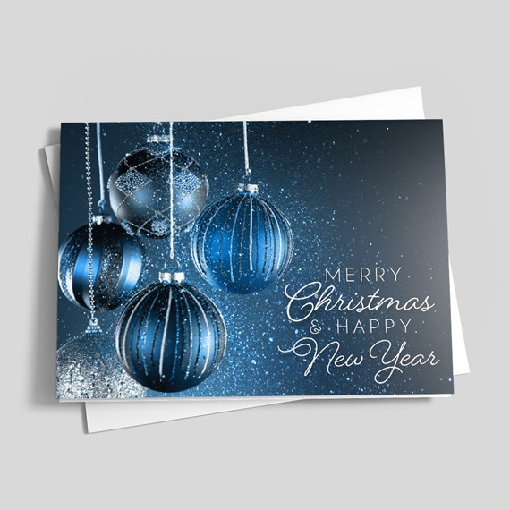 Folded Christmas card with blue hanging baubles and white "Merry Christmas & Happy New Year" text