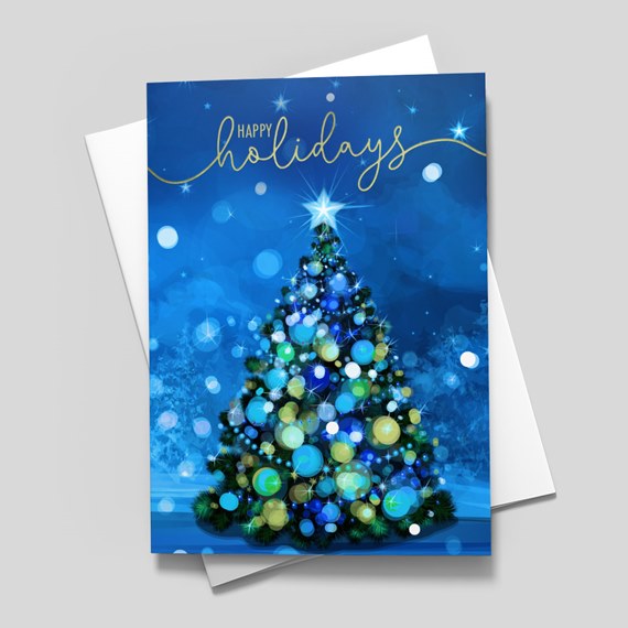 Holiday greeting card with illustrated Christmas tree, blue and green ornaments, star topper and gold 'Happy Holidays' script on a blue background.