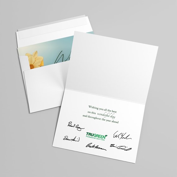 folded card with floral design and printed text