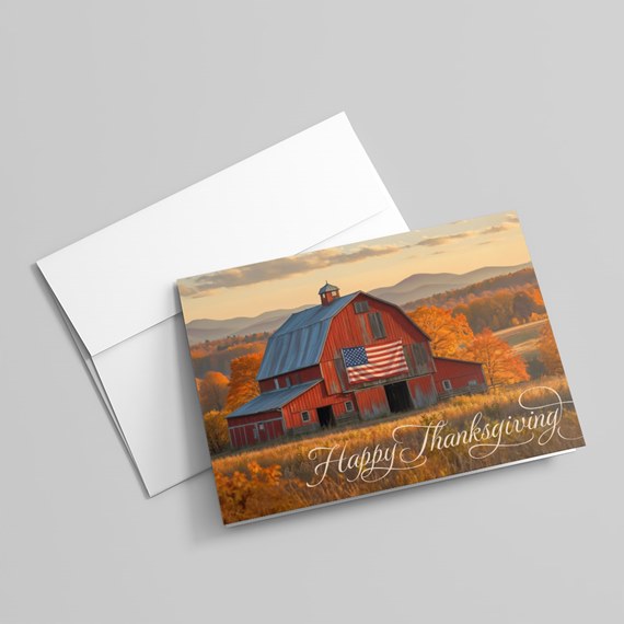 barn scene with american flag and happy thanksgiving text