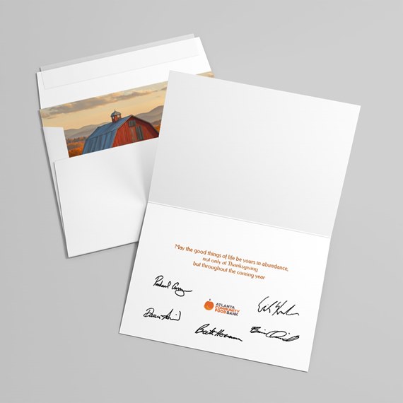 greeting card with barn illustration and orange text