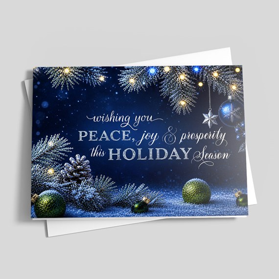 holiday card design with ornaments and pine branches