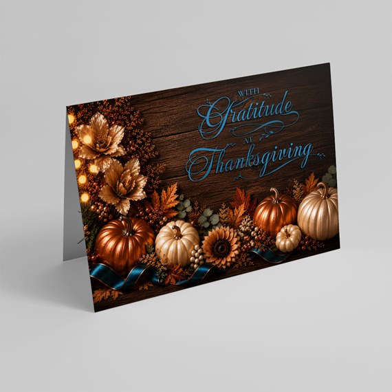 Thanksgiving card with pumpkins and autumn leaves