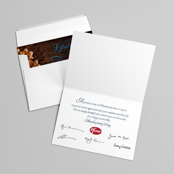 folded card with wood background and floral design, logo placeholder