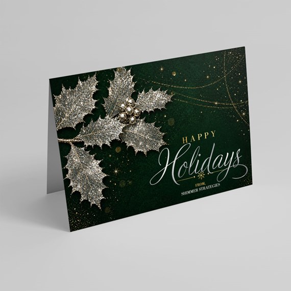 holiday card with holly leaves and gold text