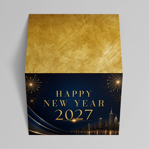 gold and navy blue box with city skyline and fireworks design