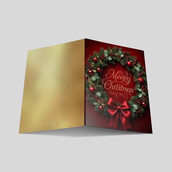 Christmas card with wreath design and gold accents