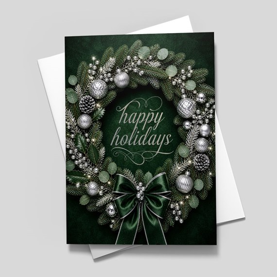 holiday wreath card with silver ornaments and bow