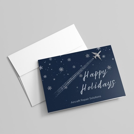 navy holiday card with airplane and snowflakes