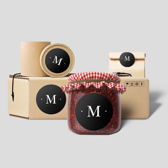 variety of packaging items with black circular labels and a red checked lid on a jar