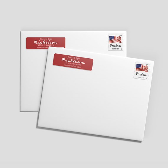 two white envelopes with red labels and stamps